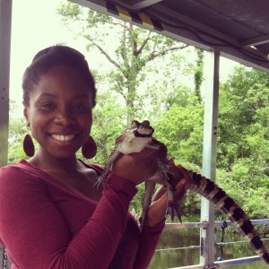 Sari holding a baby alligator