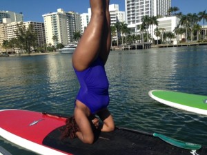 Headstand on a paddleboard. 